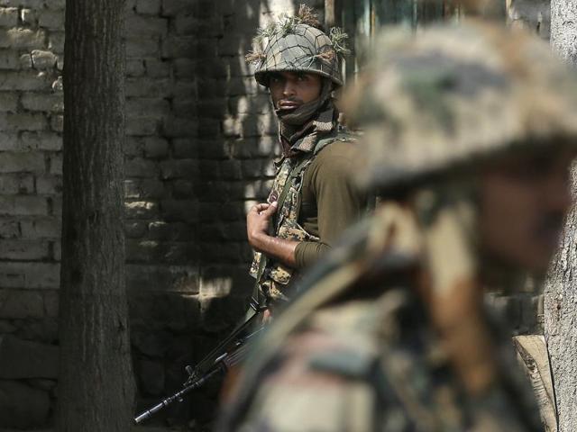 Indian army soldiers patrol near Nowgam sector, near the de facto border dividing Kashmir between India and Pakistan, in Indian controlled Kashmir. (AP File Photo)