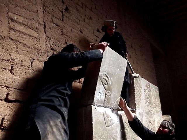 An image grab taken from a video made available by Jihadist media outlet Welayat Nineveh allegedly shows members of the Islamic State militant group destroying a stoneslab with a sledgehammer at what they said was the ancient Assyrian city of Nimrud in northern Iraq. (AFP File Photo) An image grab taken from a video made available by Jihadist media outlet Welayat Nineveh allegedly shows members of the Islamic State militant group destroying a stoneslab with a sledgehammer at what they said was the ancient Assyrian city of Nimrud in northern Iraq. (AFP File Photo)