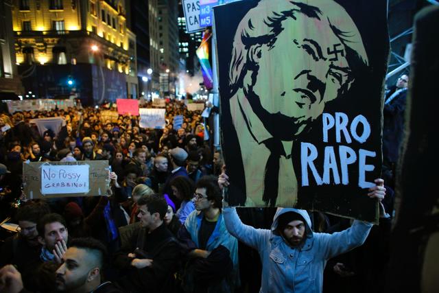 Demonstrators gather to protest a day after President-elect Donald Trump's victory, at a rally outside Los Angeles City Hall in Los Angeles, California, on Wednesday. (AFP) Demonstrators gather to protest a day after President-elect Donald Trump's victory, at a rally outside Los Angeles City Hall in Los Angeles, California, on Wednesday. (AFP)