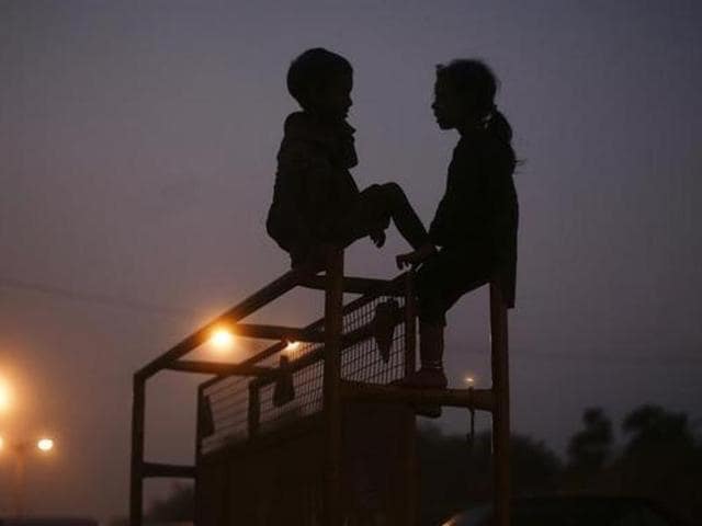 Children perched atop a police barricade in New Delhi. According to a report by International Vaccine Access Centre, nearly three lakh died from diarrhoea and pneumonia in 2016 so far.(Reuters File)