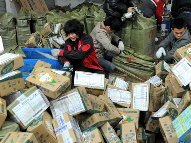Chinese workers sort through boxes of goods at a delivery company in Lin'an, China.Singles Day, or Bachelor’s Day, started in 1993, after a group of single male Nanjing university students coined the idea for an ‘anti-Valentines Day’. (AFP Photo) Chinese workers sort through boxes of goods at a delivery company in Lin'an, China.Singles Day, or Bachelor’s Day, started in 1993, after a group of single male Nanjing university students coined the idea for an ‘anti-Valentines Day’. (AFP Photo)