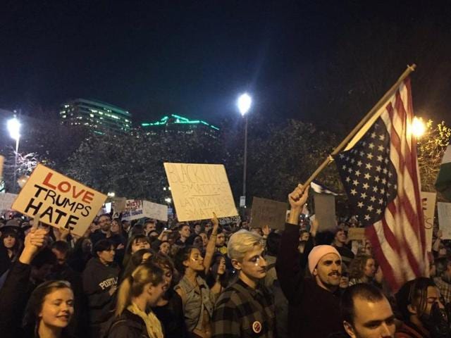 Protesters march on their way to Waterfront Park in Portland on the third day of protests over the results of the 2016 U.S. presidential election on Thursday. (AP Photo) Protesters march on their way to Waterfront Park in Portland on the third day of protests over the results of the 2016 U.S. presidential election on Thursday. (AP Photo)