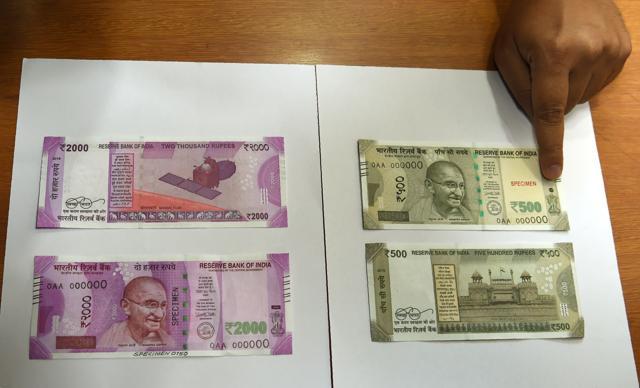 Samples of the new Rs 500 and Rs 2000 notes are displayed at the Reserve Bank of India headquarters in Mumbai on November 9. (AFP) Samples of the new Rs 500 and Rs 2000 notes are displayed at the Reserve Bank of India headquarters in Mumbai on November 9. (AFP)