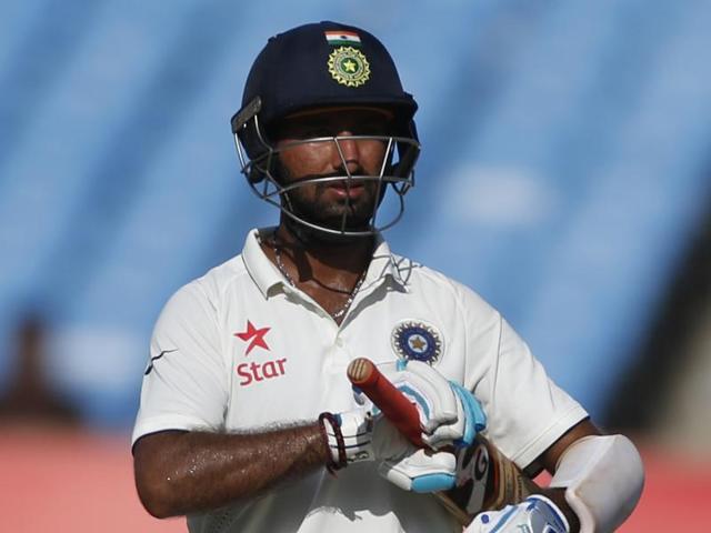 Cheteshwar Pujara’s celebrates after completing his century on the third day of the first Test match against England. (PTI) Cheteshwar Pujara’s celebrates after completing his century on the third day of the first Test match against England. (PTI)
