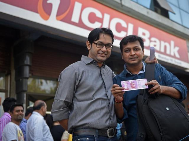 Some are glad that they finally got the cash.  (Pratik Chorge/HT PHOTO) 