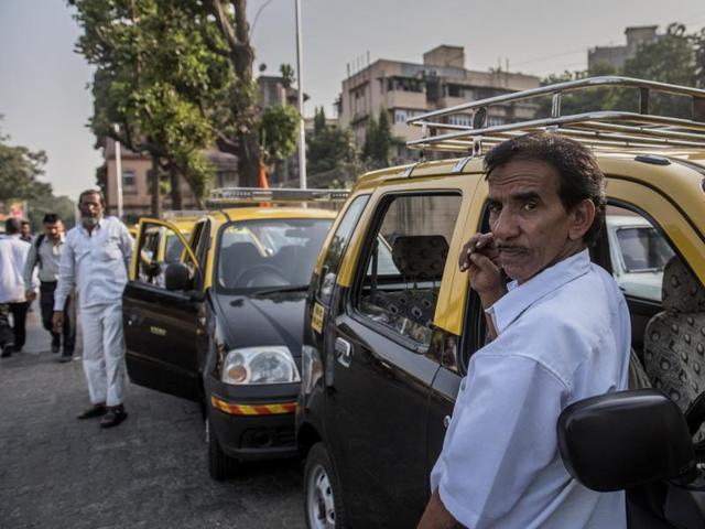 Taxi drivers, too, find it difficult to make money. (Above) A driver waits outside Mahim station. (Satish Bate/HT PHOTO) 