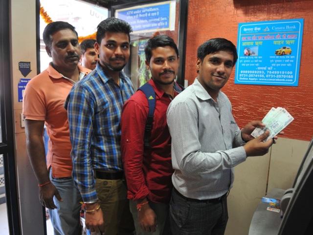 On Friday, ATMs opened to long queues, as people scrambled to withdraw money. (Shankar Mourya/HT) On Friday, ATMs opened to long queues, as people scrambled to withdraw money. (Shankar Mourya/HT)