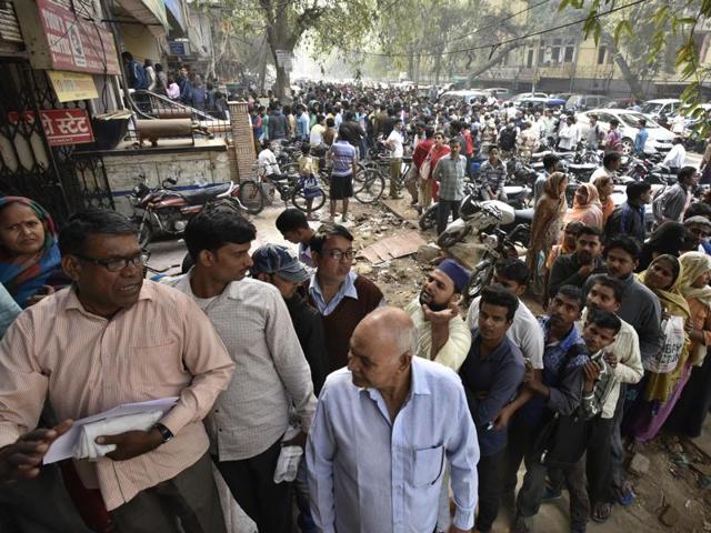 A line outside an ATM in Delhi. Millions of panicked consumers lined up outside banks and ATMs across India on Friday to exchange withdrawn banknotes but chaos ensued for the second straight day with poor cash flow and no signs of immediate relief.(aj K Raj/Hindustan Times) A line outside an ATM in Delhi. Millions of panicked consumers lined up outside banks and ATMs across India on Friday to exchange withdrawn banknotes but chaos ensued for the second straight day with poor cash flow and no signs of immediate relief.(aj K Raj/Hindustan Times)