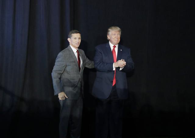 Retired Gen. Michael Flynn, left, introduces Republican presidential candidate Donald Trump at a campaign rally on September. (AP)