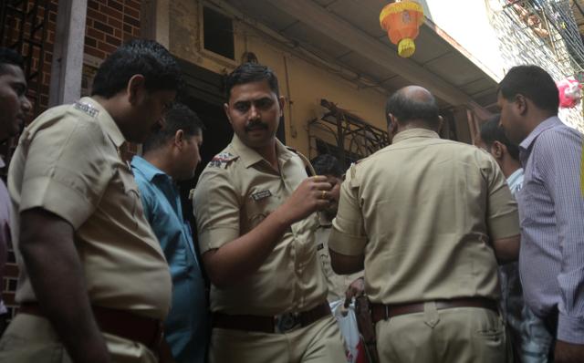 Police officers investigate the house where Anerao killed his minor daughters before committing suicide. (Prashant Waydande / Hindustan Times)