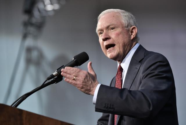 Senator Jeff Sessions speaks at a rally for Republican presidential nominee Donald Trump at Ambridge Area Senior High School on October 10. (AFP)