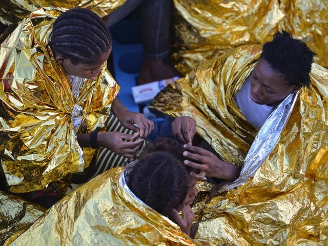 This file photo taken on November 03, 2016 shows African women aboard the Topaz Responder ship run by Maltese NGO Moas and the Red Cross after a rescue operation of migrants and refugees on November 3, 2016, off the Libyan coast in the Mediterranean Sea. They arrive in their hundreds every month, their heads full of dreams of new lives in Europe. In reality, many of them are destined for years of sexual slavery. And in Italy's migrant-saturated southern ports, prising these young Nigerian girls away from their traffickers is a formidable challenge.(AFP) This file photo taken on November 03, 2016 shows African women aboard the Topaz Responder ship run by Maltese NGO Moas and the Red Cross after a rescue operation of migrants and refugees on November 3, 2016, off the Libyan coast in the Mediterranean Sea. They arrive in their hundreds every month, their heads full of dreams of new lives in Europe. In reality, many of them are destined for years of sexual slavery. And in Italy's migrant-saturated southern ports, prising these young Nigerian girls away from their traffickers is a formidable challenge.(AFP)