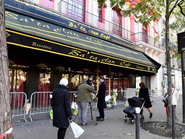 People walk in front of the Bataclan concert hall in Paris on Friday.(AFP) People walk in front of the Bataclan concert hall in Paris on Friday.(AFP)