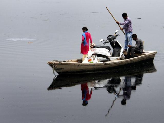 People crossing the Sutlej river in boat near a village. The water-sharing dispute is likely to become a major issue with the opposition Congress turning the heat on the Badal government ahead of next year’s assembly polls. (JS Grewal/ Hindustan Times) People crossing the Sutlej river in boat near a village. The water-sharing dispute is likely to become a major issue with the opposition Congress turning the heat on the Badal government ahead of next year’s assembly polls. (JS Grewal/ Hindustan Times)