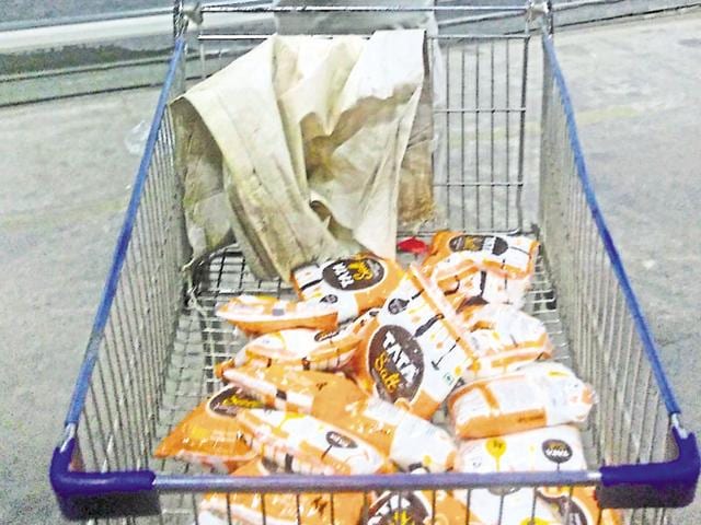 A man coming out of Zirakpur mall after making bulk purchase of salt on Friday. (Sant Arora/HT Photo) A man coming out of Zirakpur mall after making bulk purchase of salt on Friday. (Sant Arora/HT Photo)