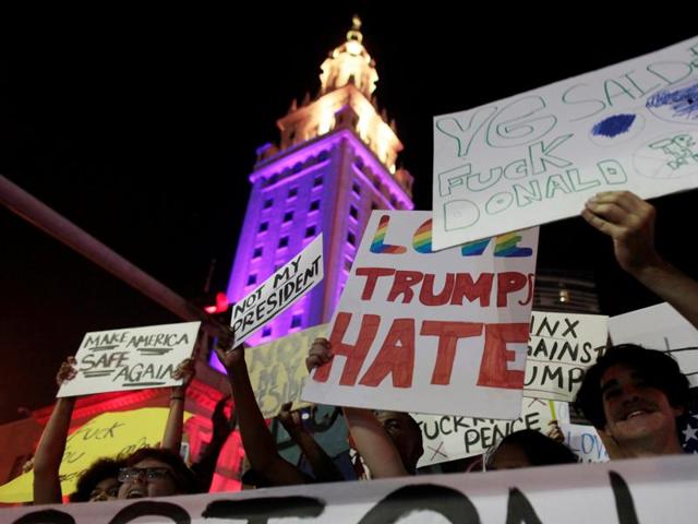 People protest against US President-elect Donald Trump in Miami, Florida, US on Friday. (REUTERS) People protest against US President-elect Donald Trump in Miami, Florida, US on Friday. (REUTERS)