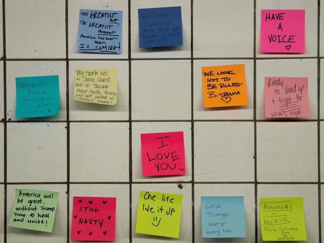 Subway riders write post-it notes on the walls of a subway tunnel in New York City on November 10. New York commuters are venting anger and frustration over Republican Donald Trump's shock victory by indulging in collective therapy -- writing messages on post-it notes and sticking them on a subway wall. (AFP) Subway riders write post-it notes on the walls of a subway tunnel in New York City on November 10. New York commuters are venting anger and frustration over Republican Donald Trump's shock victory by indulging in collective therapy -- writing messages on post-it notes and sticking them on a subway wall. (AFP)