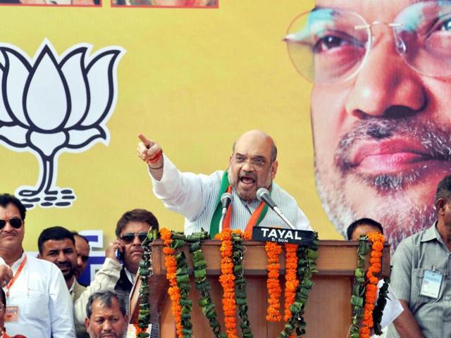 Bharatiya Janata Party president Amit Shah addresses the party's Parivartan Yatra rally in Dehradun on Sunday. (PTI Photo) Bharatiya Janata Party president Amit Shah addresses the party's Parivartan Yatra rally in Dehradun on Sunday. (PTI Photo)