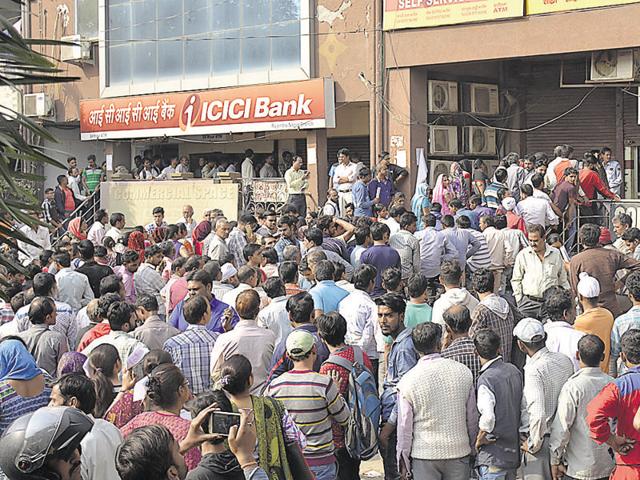 Long queues were witnessed outside ATMs in Ghaziabad(Sakib Ali/HT Photo)