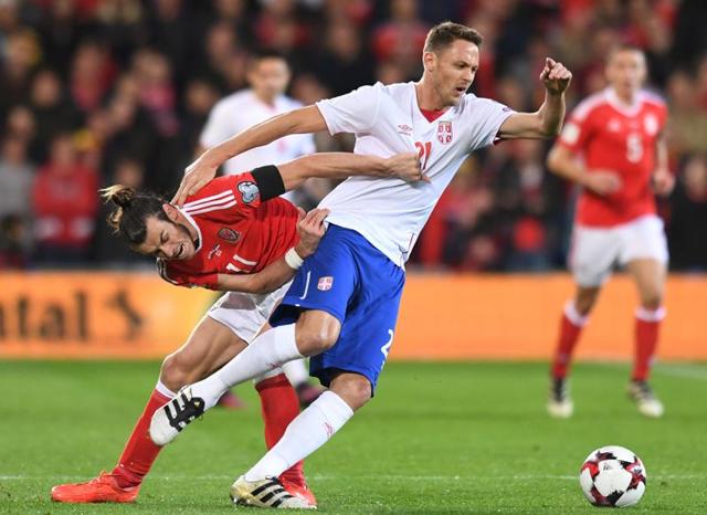 It was a disappointing outing for Wales forward Gareth Bale (left) whose 30th minute goal was negated by Serbia’s Aleksander Mitrovic through a late strike in Cardiff on Saturday. (AFP) It was a disappointing outing for Wales forward Gareth Bale (left) whose 30th minute goal was negated by Serbia’s Aleksander Mitrovic through a late strike in Cardiff on Saturday. (AFP)