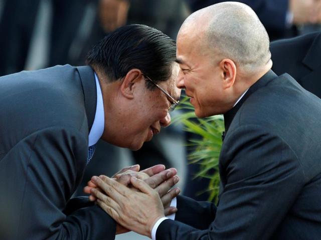Cambodia's King Norodom Sihamoni (R) greets Prime Minister Hun Sen as they attend the annual Water Festival on the Tonle Sap river in Phnom Penh. (Reuters) Cambodia's King Norodom Sihamoni (R) greets Prime Minister Hun Sen as they attend the annual Water Festival on the Tonle Sap river in Phnom Penh. (Reuters)