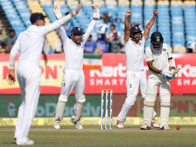 England's players successfully appeals for India's Cheteshwar Pujara's (R) dismissal.(REUTERS)