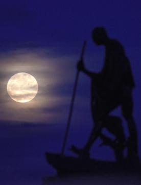 A supermoon rises behind a statue of Mahatma Gandhi at Marina Beach in Chennai. (AFP Photo) A supermoon rises behind a statue of Mahatma Gandhi at Marina Beach in Chennai. (AFP Photo)