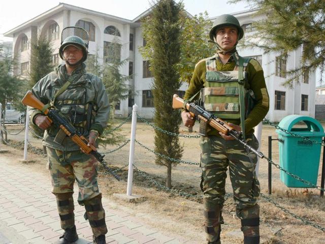 Security personnel stand guard at the head office of Jammu and Kashmir state board in Srinagar.(PTI File Photo) Security personnel stand guard at the head office of Jammu and Kashmir state board in Srinagar.(PTI File Photo)