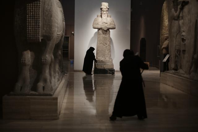 Iraqi workers mop the floor at the Assyrian Hall of the Iraq National Museum Baghdad. (AP FIle Photo) Iraqi workers mop the floor at the Assyrian Hall of the Iraq National Museum Baghdad. (AP FIle Photo)