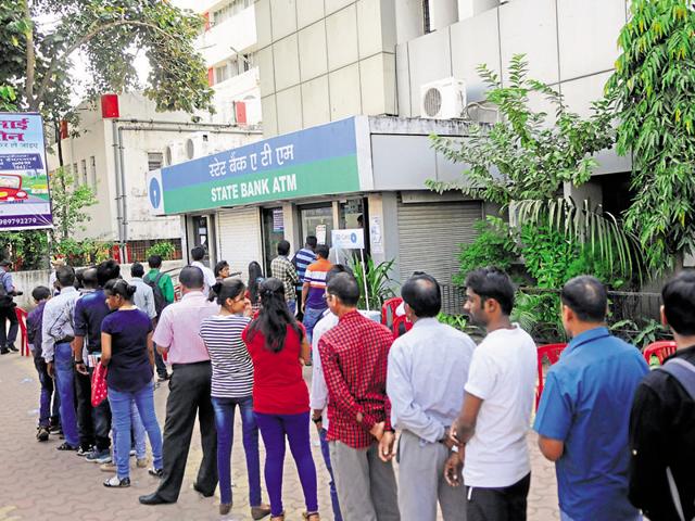 People queue outside a State Bank of India ATM in Bhopal on Sunday. (Mujeeb Faruqui/HT photo) People queue outside a State Bank of India ATM in Bhopal on Sunday. (Mujeeb Faruqui/HT photo)