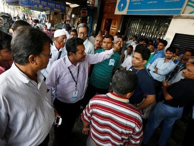 People wait their turn to exchange 500 and 1000 rupee banknotes in Siliguri on November 13, 2016. (AFP) People wait their turn to exchange 500 and 1000 rupee banknotes in Siliguri on November 13, 2016. (AFP)