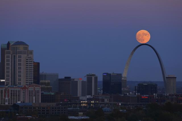 The moon rises beyond the Arch in St. Louis as seen from the Compton Hill Water Tower. (AP Photo) The moon rises beyond the Arch in St. Louis as seen from the Compton Hill Water Tower. (AP Photo)