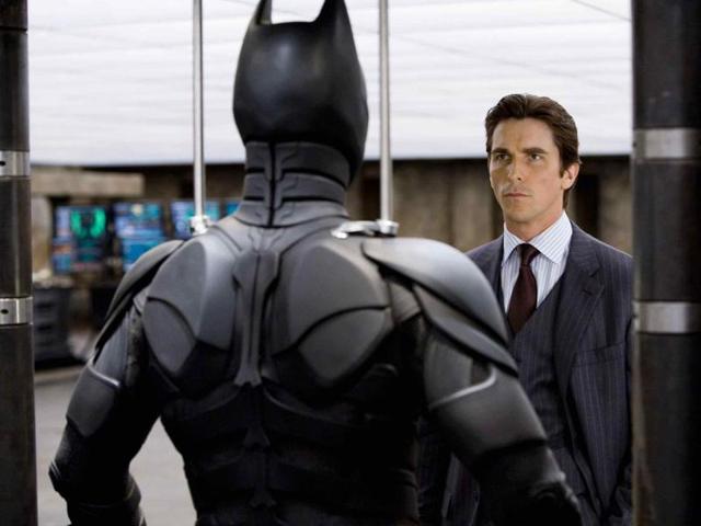 Bruce Wayne probably owns all the banks where you’re queued up right now. Bruce Wayne probably owns all the banks where you’re queued up right now.