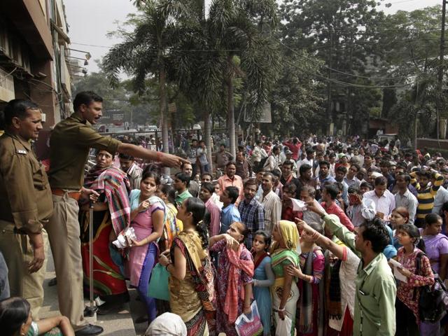 People’s patience is wearing thin as they wait in long queues for hours to withdraw money after 86% of the total currency in circulation by value was scrapped from November 9.(AP File Photo)