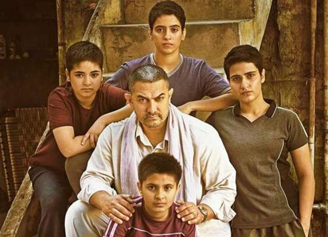 Aamir Khan poses with his co-stars on the poster of his upcoming film, Dangal. (Facebook/Dangal The Film) Aamir Khan poses with his co-stars on the poster of his upcoming film, Dangal. (Facebook/Dangal The Film)