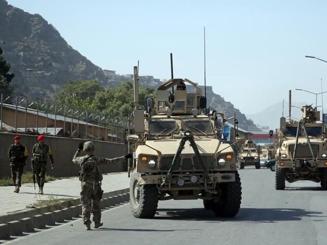 US army personnel interact with an Afghan local. US forces may have committed war crimes in Afghanistan from 2003-2004 by torturing prisoners in what appeared to be a deliberate policy.(Agencies FIle Photo) US army personnel interact with an Afghan local. US forces may have committed war crimes in Afghanistan from 2003-2004 by torturing prisoners in what appeared to be a deliberate policy.(Agencies FIle Photo)