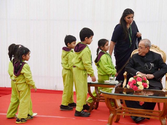 President Pranab Mukherjee being greeted by children during the children's day function in New Delhi on Monday. (PTI) President Pranab Mukherjee being greeted by children during the children's day function in New Delhi on Monday. (PTI)