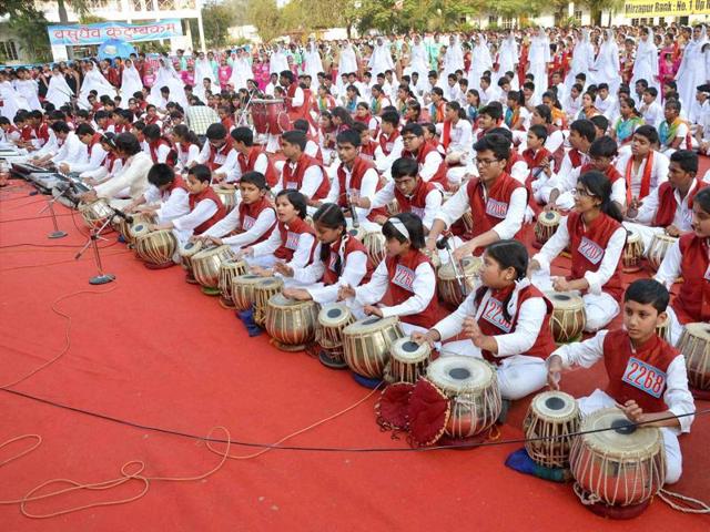 School children participating in a musical program for world peace on the occasion of Children’s Day in Mirzapur, Uttar Pradesh on Monday. (PTI) School children participating in a musical program for world peace on the occasion of Children’s Day in Mirzapur, Uttar Pradesh on Monday. (PTI)