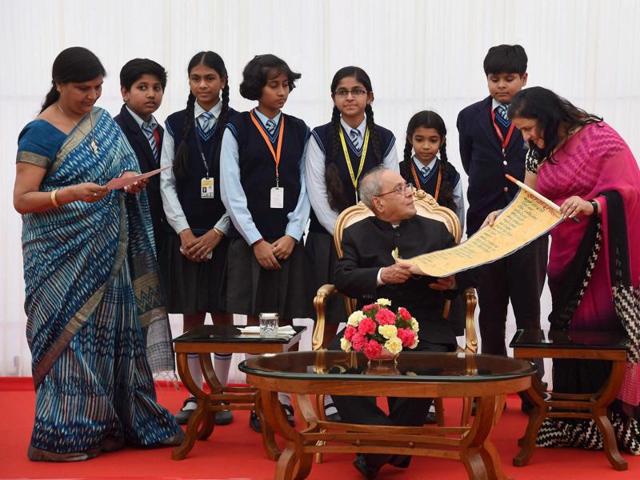 President Pranab Mukherjee with children on the occasion of Children's Day in New Delhi on Monday. (PTI) President Pranab Mukherjee with children on the occasion of Children's Day in New Delhi on Monday. (PTI)