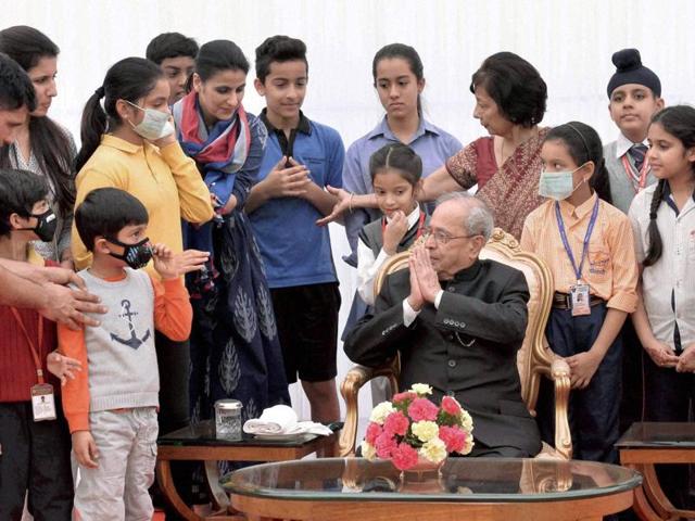 President Pranab Mukherjee meeting the students and teachers on the occasion of Children's Day at the Rashtrapati Bhavan in New Delhi on Monday. (PTI) President Pranab Mukherjee meeting the students and teachers on the occasion of Children's Day at the Rashtrapati Bhavan in New Delhi on Monday. (PTI)