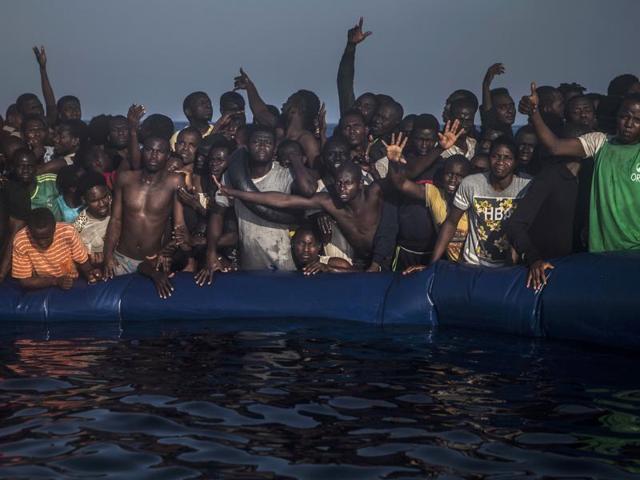 African refugees and migrants react aboard a partially punctured rubber boat as they wait to be assisted , during a rescue operation on the Mediterranean Sea on Sept 10. (AP File Photo) African refugees and migrants react aboard a partially punctured rubber boat as they wait to be assisted , during a rescue operation on the Mediterranean Sea on Sept 10. (AP File Photo)