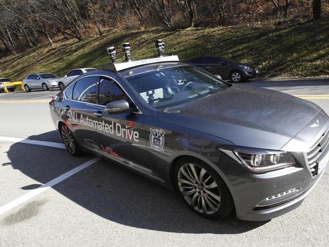 The driverless car called Snuber, front, is test driven during a demonstration at the Seoul National University's campus in Seoul. (AP Photo) The driverless car called Snuber, front, is test driven during a demonstration at the Seoul National University's campus in Seoul. (AP Photo)