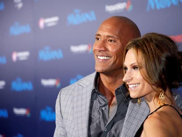 Actor Dwayne Johnson and Lauren Hashian pose at the world premiere of Moana, the new film by Disney Animation, about the young daughter of the chief of the tribe, Moana from Motunui Island, who is chosen by the ocean to reunite the heart of Tehiti. She sets sail in search of Maui, a legendary demigod and hopes to save her people. (REUTERS) Actor Dwayne Johnson and Lauren Hashian pose at the world premiere of Moana, the new film by Disney Animation, about the young daughter of the chief of the tribe, Moana from Motunui Island, who is chosen by the ocean to reunite the heart of Tehiti. She sets sail in search of Maui, a legendary demigod and hopes to save her people. (REUTERS)
