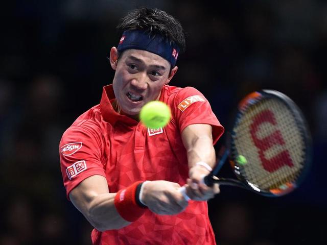 Japan's Kei Nishikori returns to Switzerland's Stan Wawrinka during their round robin stage men's singles match at ATP Finals. (AFP) Japan's Kei Nishikori returns to Switzerland's Stan Wawrinka during their round robin stage men's singles match at ATP Finals. (AFP)