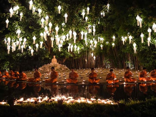 Novice Buddhist monks pray at Chaing Mai’s Wat Phan Tao temple to mark the beginning of the annual Yi Peng festival.  (AFP) 