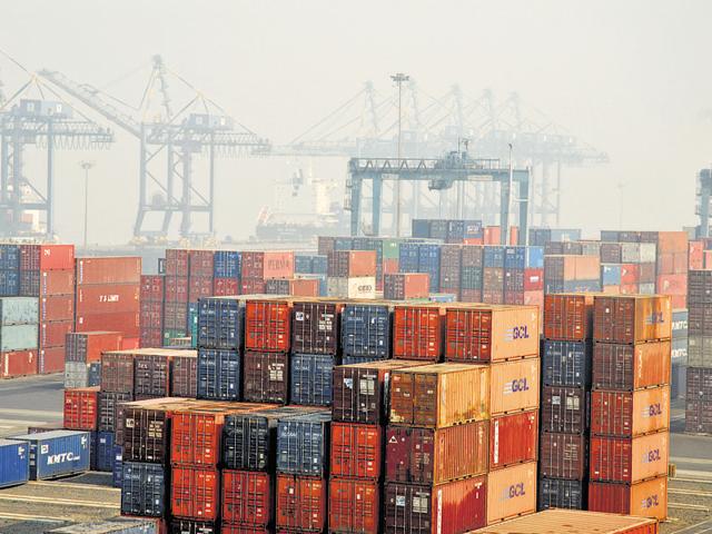 An aerial view from a crane, of containers being off-loaded from a ship to a truck at JNPT port.(File photo)