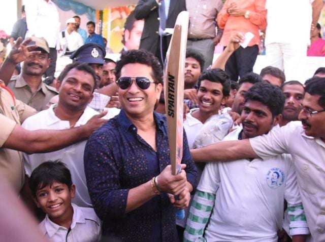 Sachin Tendulkar takes a selfie with villagers of PR Kandriga in Andhra Pradesh. Tendulkar had dispersed money from his MP funds for local area development two years ago. (HT Photo) Sachin Tendulkar takes a selfie with villagers of PR Kandriga in Andhra Pradesh. Tendulkar had dispersed money from his MP funds for local area development two years ago. (HT Photo)