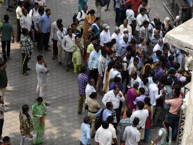 People queue up outside a bank branch at Sion on Wednesday. (Kunal Patil) People queue up outside a bank branch at Sion on Wednesday. (Kunal Patil)