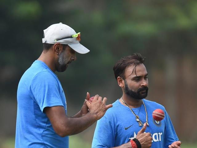 India's Ravichandran Ashwin (left) and Amit Mishra during nets at the Dr. Y.S. Rajasekhara Reddy ACA-VDCA Cricket Stadium in Vishakhapatnam. England batsmen played both Ashwin and Mishra with relative ease in the drawn Rajkot Test. (AFP)