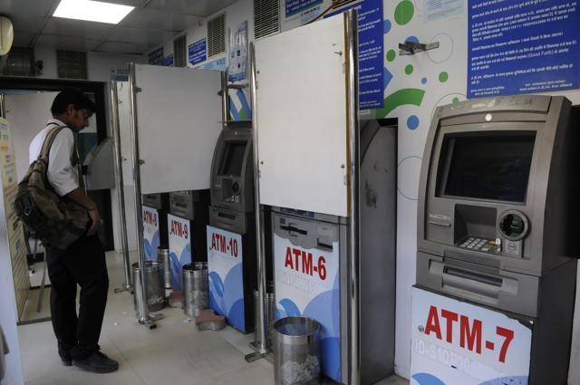 A youth checks cashless ATMs in Bhopal (Mujeeb Faruqui/HT Photo) A youth checks cashless ATMs in Bhopal (Mujeeb Faruqui/HT Photo)
